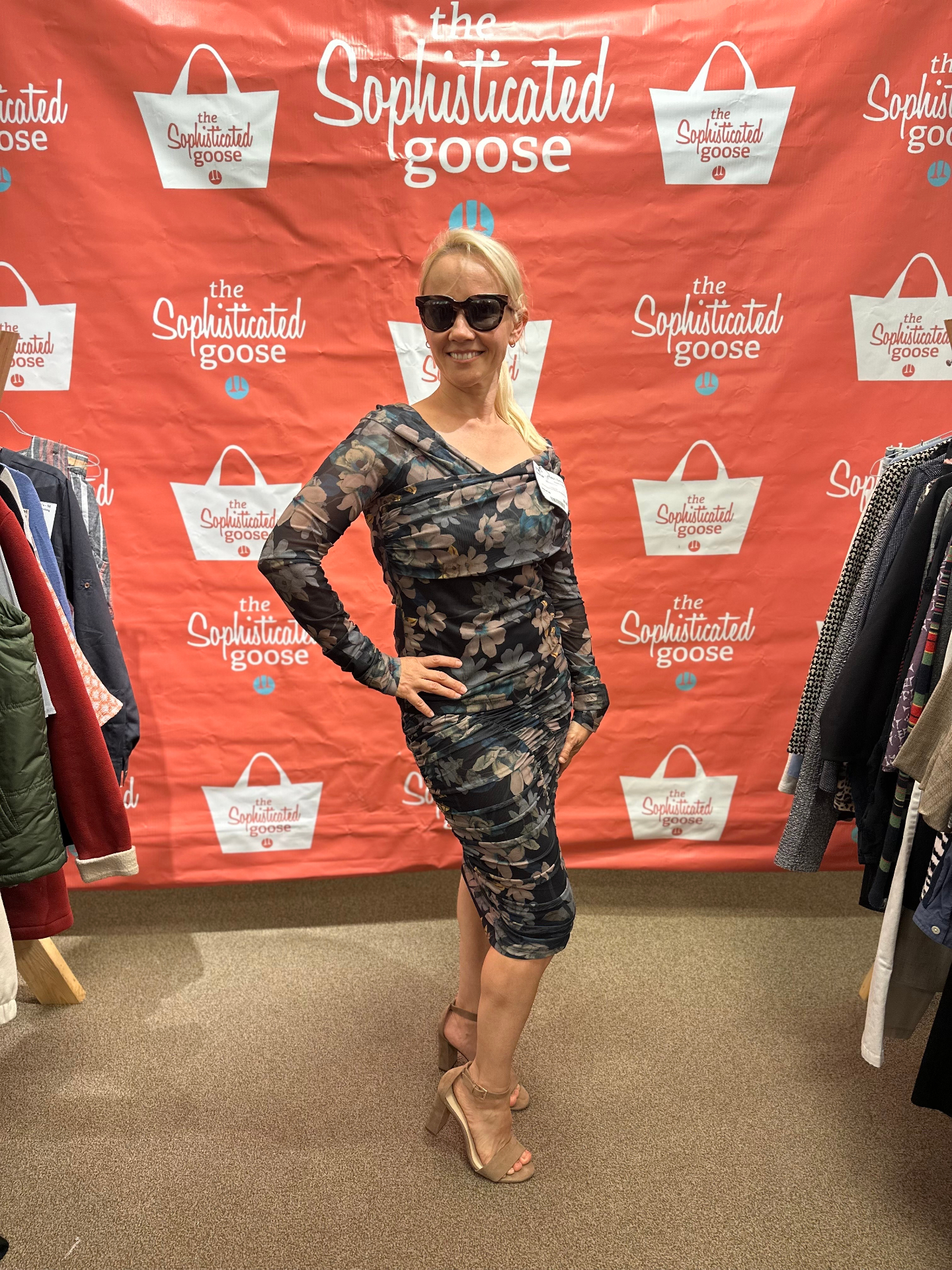 Shopper posing at The Sophisticated Goose backdrop